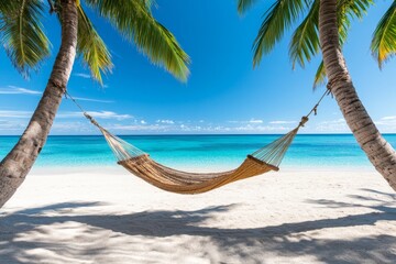 Fototapeta premium A hammock strung between two palm trees, overlooking a peaceful beach, symbolizing relaxation