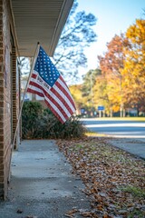 An American flag displayed outside a polling station. The sun is shining, casting warm natural light on the scene.