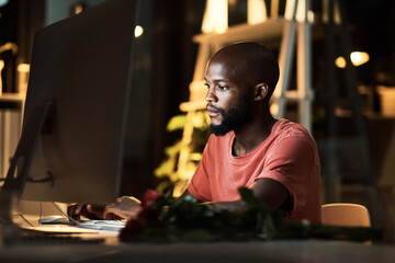 Night, black man and serious in office, computer and video editing with software, planning and freelancer. Dark, entrepreneur and creative for content creation, person and business in social media