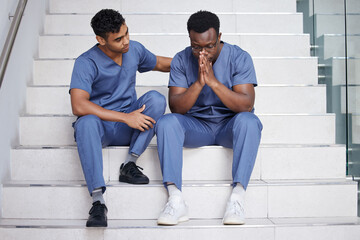 Men, doctors and comfort with stress at hospital for medical mistake, depression and healthcare...