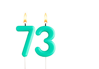 Birthday number 73 - Green birthday candle on white background