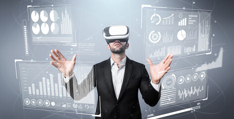 Skilled business man looking data analysis while planning strategy by using visual reality glasses. Professional smart investor checking financial graph holographic while wearing VR goggle. Deviation.
