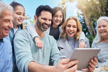 Family, generations and outdoor with smile on tablet for streaming service and funny videos in Australia. People, grandparents and parents with kids in park on internet for memes on social media post