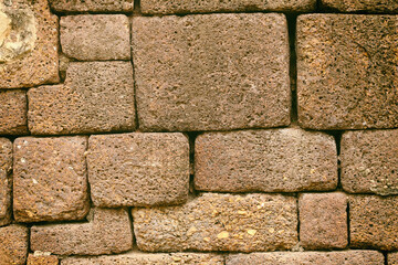 Brick blocks placed together to form a wall.