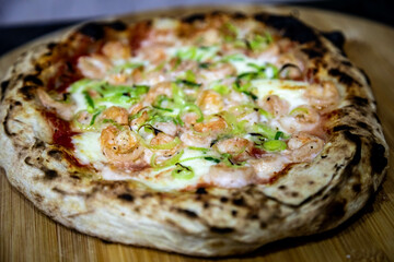 Rustic artisanal shrimp pizza with catupiry cheese and leeks