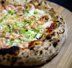Rustic artisanal shrimp pizza with catupiry cheese and leeks