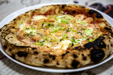 Rustic artisanal shrimp pizza with catupiry cheese and leeks