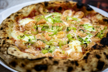 Rustic artisanal shrimp pizza with catupiry cheese and leeks