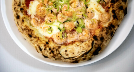 Rustic artisanal shrimp pizza with catupiry cheese and leeks
