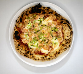 Rustic artisanal shrimp pizza with catupiry cheese and leeks