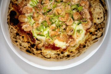 Rustic artisanal shrimp pizza with catupiry cheese and leeks