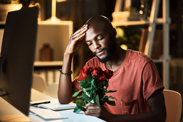 Man, bored and working in office at night, roses and mental health burnout on valentines day. Male person, tired professional and stress to cancel date, depression and exhausted employee for fail