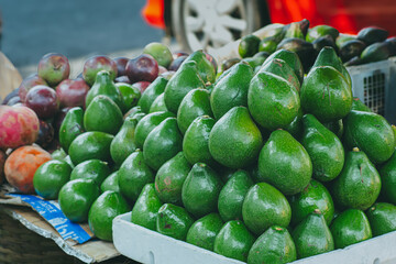 Avocado, bispul, chocolate sapodilla fruit sold by street vendors around Suryakencana, Bogor City, Indonesia