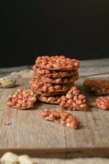 Thai Fried Peanut Cookies on dark background. Deep Fried Bean cookies peanut crackers made from nuts and flour to fry.