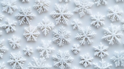 A collection of beautifully detailed white snowflakes on a soft background, perfect for winter-themed designs and seasonal decorations.