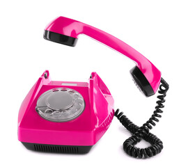 Old magenta color telephone with rotary dial isolated on white