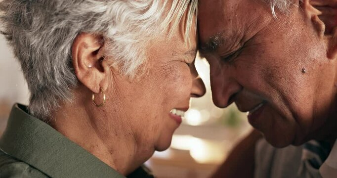 Senior, couple and bonding with love in home for romance, loyalty and commitment in marriage with smile. Elderly, people and affection with intimacy, trust or support in retirement in lounge of house