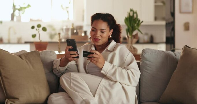 Woman, credit card and relax with phone on sofa for online shopping, payment or banking app at home. Young, female person or shopper with debit or mobile smartphone for ecommerce or purchase at house