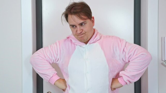 Man animator in pink kigurumi pajamas, return home through door, taking off hood, look dissatisfied, silent, reproaching, arms to side, toxic relationships in family, abusive father parenting conflict