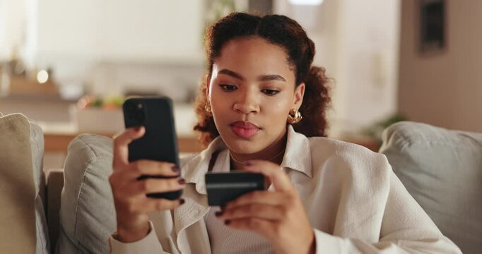 Woman, credit card or phone with electronic transaction for online shopping, payment or banking on sofa at home. Young, female person or shopper with debit or mobile smartphone for ecommerce at house