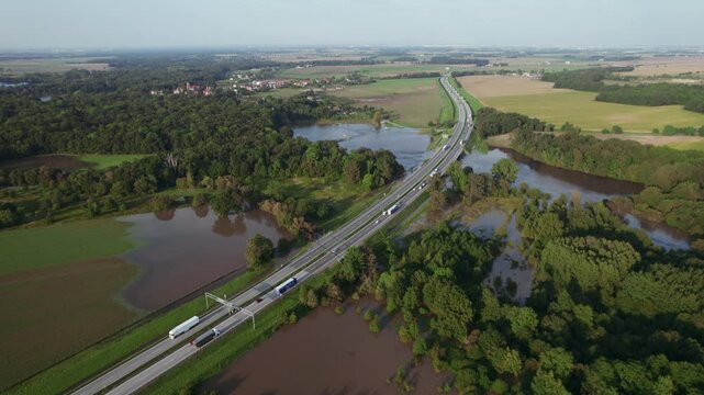 Katy Wroclawskie, Lower Silesia, Poland - September 19 2024: Aerial view of rising rivers threaten southern Poland near Wroclaw, A4 Autostrada Highway, Bystzryca river floods roads and villages
