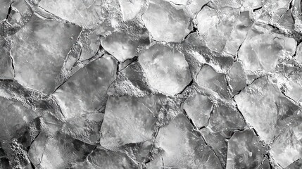Obraz premium Gray Ice Texture. A close-up of ice with cracks and textures in various shades of gray.