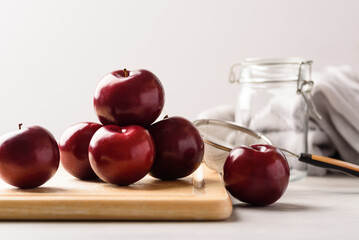 Fresh red plum on white background