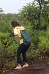 couple walking in the woods  Hikers, nature tourism, beautiful, big, rich forest