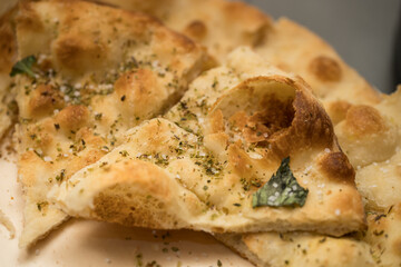 Focaccia recipe with tomatoes and aromatic herbs (rosemary, basil), with olives, garlic or feta...