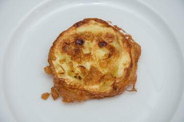 Plate with fried pumpkin slices with egg, Romania 2024