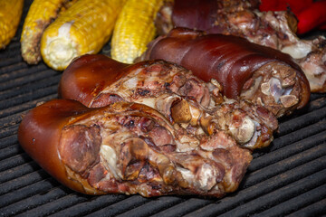 a piece of grilled pork knuckle in Transylvania, Romania 2025