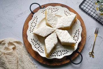 Malaysian Traditional Dessert known as Kuih Talam Pisang or Steamed Banana Cake.