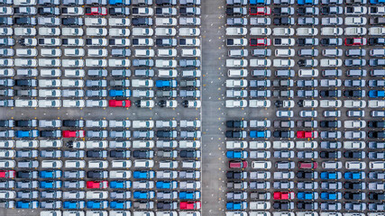 Aerial view new cars lined up in the port for import and export, Top view of new cars lined up automobile factory global logistic import export, New cars logistic to dealership for sale.