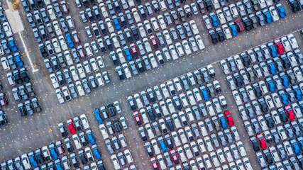 Aerial view new cars lined up in the port for import and export, Top view of new cars lined up automobile factory global logistic import export, New cars logistic to dealership for sale.