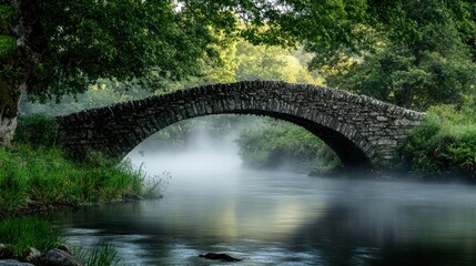 Fototapeta premium Stone Bridge Over Mist-Covered River