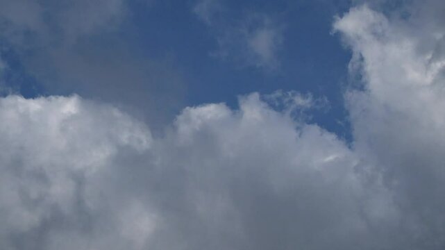 Time lapse of fast moving clouds blue sky background. cloud footage with 4K quality and 60Fps can be used for slow motion