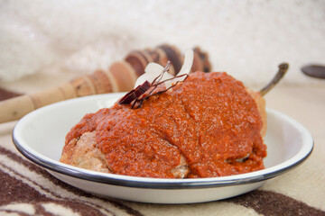 Authentic mexican food Chile capeado with adobo sauce, stuffed poblano pepper and chipotle chili sauce.