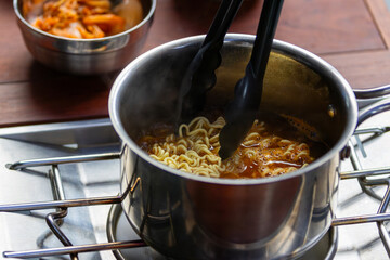 Ramen is a popular Japanese noodle dish consisting of Chinese-style wheat noodles served in a flavorful broth. The broth is typically made from a base of pork, chicken, or seafood