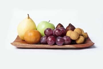 Assortment of exotic fruits isolated on white background. Close up of heap of fruit. Concept of healthy eating and dieting lifestyle. 