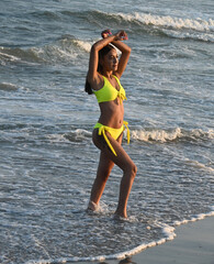 Beautiful young woman at the beach