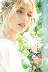 Fototapeta premium a woman with a flower in her hair and a white shirt with the word on it