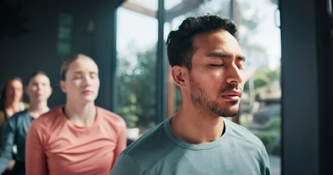 Yoga, class and peaceful with meditation in studio for holistic wellness, mindfulness and spiritual healing on floor. People, man and breathing for mental health balance, diversity and eyes closed