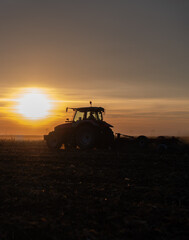 Tractor preparing the land for a new crop planting