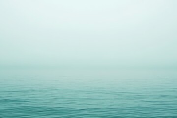 Obraz premium Serene Fog Over Calm Water Surface