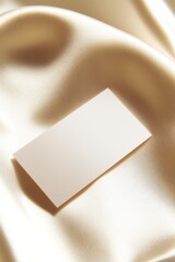 Obraz premium Elegant Satin Background with Blank Business Card for Fashion Branding