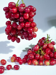 Fresh Bunch of Plump Red Grapes on White Background