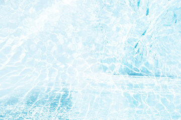 Blue water with ripples on the surface. Defocus blurred transparent blue colored clear calm water surface texture with splashes and bubbles. Water waves with shining pattern texture background.