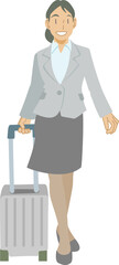 スーツケースを持って移動するビジネスウーマン