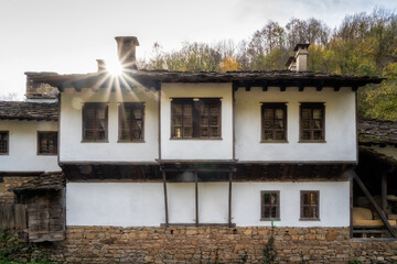 Amazing autumn view of an old beautiful houses in the Open Air Ethnographic Museum 