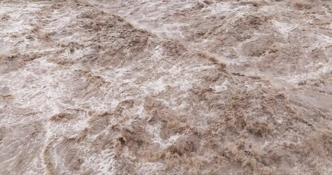close up of flood water flowing in the river
